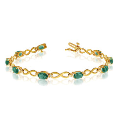 14K Yellow Gold Oval Emerald Stones And Diamonds Infinity Tennis Bracelet, 7" - JewelryAffairs